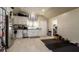Spacious kitchen featuring stainless steel appliances, white cabinetry, and tile flooring at 1727 E Manasota Beach Rd, Englewood, FL 34223