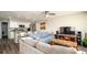 Open-concept living room connected to kitchen and featuring modern furniture at 1727 E Manasota Beach Rd, Englewood, FL 34223
