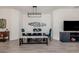 Open dining area features a long table with chairs and bench seating and modern light fixture at 18002 Franklin Park Ct, Venice, FL 34293