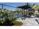 Well-maintained pickleball courts with shaded seating areas and lush landscaping, promoting a recreational lifestyle at 18002 Franklin Park Ct, Venice, FL 34293