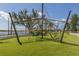 Unique playground with climbing structures, slides, and green turf, providing a safe and fun environment for children at 18002 Franklin Park Ct, Venice, FL 34293