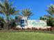 Wysteria Wellen Park community entrance sign with a vibrant flower logo at 18002 Franklin Park Ct, Venice, FL 34293