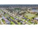Expansive aerial view of a community with canal-front homes and lush landscaping at 194 Sportsman Rd, Rotonda West, FL 33947