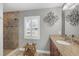Bathroom with walk-in shower, granite countertop, and stylish fixtures at 194 Sportsman Rd, Rotonda West, FL 33947