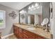 Bathroom featuring double sinks, granite countertops, and stylish fixtures at 194 Sportsman Rd, Rotonda West, FL 33947
