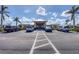 The community building features an inviting entrance, manicured landscaping, and ample parking at 194 Sportsman Rd, Rotonda West, FL 33947