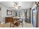 Dining area bathed in natural light with views of the screened-in patio and pool at 194 Sportsman Rd, Rotonda West, FL 33947