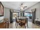 Dining area bathed in natural light with views of the screened-in patio and pool at 194 Sportsman Rd, Rotonda West, FL 33947
