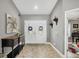 Foyer featuring double doors, tile flooring, and decorative accents at 194 Sportsman Rd, Rotonda West, FL 33947