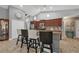 Modern kitchen with stainless steel appliances, granite countertops, and bar seating at 194 Sportsman Rd, Rotonda West, FL 33947