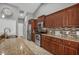 Well-lit kitchen featuring stainless steel appliances and wooden cabinets at 194 Sportsman Rd, Rotonda West, FL 33947
