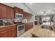Well-equipped kitchen featuring stainless steel appliances, granite countertops, and ample cabinet space at 194 Sportsman Rd, Rotonda West, FL 33947