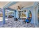 The lanai features a sitting area, surfboard, and a panoramic view of the pool and lush backyard at 194 Sportsman Rd, Rotonda West, FL 33947