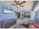 Lanai featuring comfortable seating, a mounted television, and backyard views at 194 Sportsman Rd, Rotonda West, FL 33947