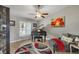 Living room featuring a piano, stylish decor, a ceiling fan, and natural light from a window at 194 Sportsman Rd, Rotonda West, FL 33947