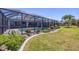 Beautiful screened pool area with lush landscaping, perfect for outdoor enjoyment and relaxation at 194 Sportsman Rd, Rotonda West, FL 33947