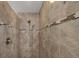 Walk-in shower featuring tile surround and a sleek design at 194 Sportsman Rd, Rotonda West, FL 33947