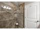 Bathroom shower with glass door, tile surround, and built-in shower seat at 194 Sportsman Rd, Rotonda West, FL 33947