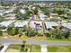 Picture of a quiet residential street with single-Gathering homes and lush greenery, offering a serene living environment at 201 Bayside Ct, Nokomis, FL 34275
