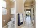 Bathroom with toilet and access to outdoor pool area at 201 Bayside Ct, Nokomis, FL 34275