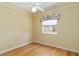 Bedroom featuring hardwood floors, neutral walls, a window and a ceiling fan at 201 Bayside Ct, Nokomis, FL 34275