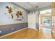 Bedroom with hardwood floors, double door closet, and an entryway that leads to the pool area at 201 Bayside Ct, Nokomis, FL 34275