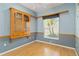 Bedroom featuring hardwood floors, built in shelving, and a window with privacy blinds at 201 Bayside Ct, Nokomis, FL 34275