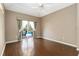 Bedroom with hardwood floors and sliding door access to the pool area at 201 Bayside Ct, Nokomis, FL 34275
