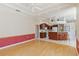Open living area flowing into kitchen with breakfast bar and tile flooring at 201 Bayside Ct, Nokomis, FL 34275