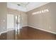 Main bedroom features hardwood floors, a decorative window and a bathroom with a tile floor at 201 Bayside Ct, Nokomis, FL 34275