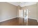Main bedroom features hardwood floors and bathroom access with a tile floor at 201 Bayside Ct, Nokomis, FL 34275