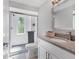 Bathroom featuring a glass shower, tile floor, and modern sink at 203 Palm Ave, Nokomis, FL 34275