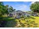 Beautiful screened-in lanai with manicured lawn and landscaping, great for outdoor living and entertaining at 2187 Calusa Lakes Blvd, Nokomis, FL 34275