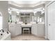 Lavish bathroom featuring garden tub, double vanities, a makeup area, and ample lighting for your comfort at 2187 Calusa Lakes Blvd, Nokomis, FL 34275