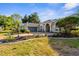 Beautiful single-story home with manicured lawn, mature landscaping, and a two-car garage at 2187 Calusa Lakes Blvd, Nokomis, FL 34275