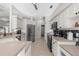 Updated kitchen with stainless steel appliances, white cabinets and a black backsplash for a modern look at 2187 Calusa Lakes Blvd, Nokomis, FL 34275