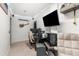 Well lit home office featuring a large display, neutral carpet, and comfortable chair at 2187 Calusa Lakes Blvd, Nokomis, FL 34275
