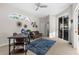 Cozy office area with plenty of natural light, a futon, and a large rug at 2187 Calusa Lakes Blvd, Nokomis, FL 34275
