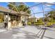 Screened lanai with outdoor kitchen, pool, bar seating and tanning chairs at 2187 Calusa Lakes Blvd, Nokomis, FL 34275
