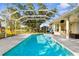 Inviting private pool with a screened enclosure and ample deck space for lounging and entertainment at 2187 Calusa Lakes Blvd, Nokomis, FL 34275