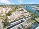 Stunning aerial view of waterfront condos featuring boat docks, a pool and a marina at 230 Santa Maria St # 333, Venice, FL 34285