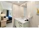 Clean, bright bathroom with updated vanity and decor, leading to an adjacent bedroom at 230 Santa Maria St # 333, Venice, FL 34285