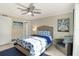 Bright and inviting bedroom with cool-toned accents, ample natural light, and beachy decor at 230 Santa Maria St # 333, Venice, FL 34285