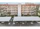 Full building view with assigned parking and landscaping at 230 Santa Maria St # 333, Venice, FL 34285
