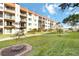 Landscaped exterior with walking path and view of the building at 230 Santa Maria St # 333, Venice, FL 34285