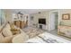 Comfortable living room with a view of the dining area, access to bedroom, and natural sunlight at 230 Santa Maria St # 333, Venice, FL 34285