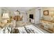 Bright living room with dining area in view, cozy sofa, and tasteful decor at 230 Santa Maria St # 333, Venice, FL 34285
