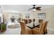 Inviting living room featuring neutral paint, modern furnishings, dining area, and lots of natural light from the window at 230 Santa Maria St # 333, Venice, FL 34285