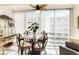 Inviting sun room with a glass-top dining table, perfect for enjoying meals with a view at 230 Santa Maria St # 333, Venice, FL 34285