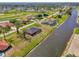 Overhead shot showcasing canal-front property near a golf course, highlighting a serene and picturesque neighborhood at 233 Rotonda Cir, Rotonda West, FL 33947